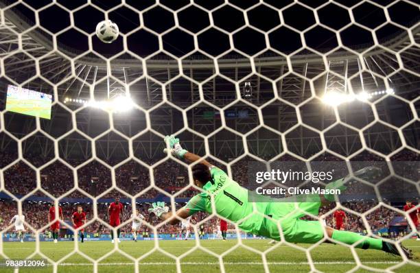 Karim Ansarifard of Iran scores past Rui Patricio of Portugal his team's first goal from the peanlty spot during the 2018 FIFA World Cup Russia group...