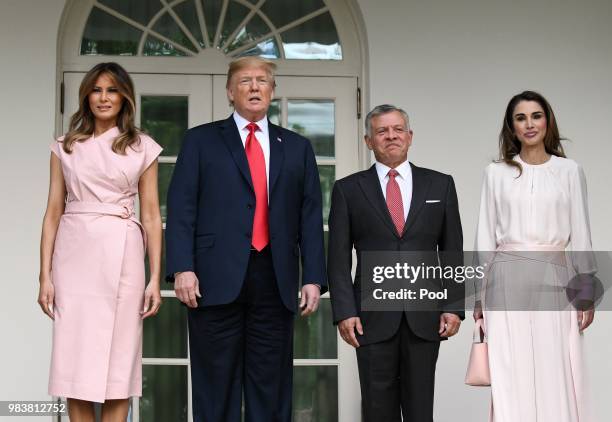 President Donald Trump and first lady Melania Trump greet King Abdullah II and Queen Rania of Jordan on their arrival at the South Portico of the...