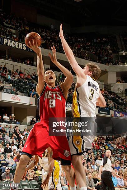 Yi Jianlian of the New Jersey Nets battles Troy Murphy of the Indiana Pacers at Conseco Fieldhouse on April 10, 2010 in Indianapolis, Indiana. NOTE...