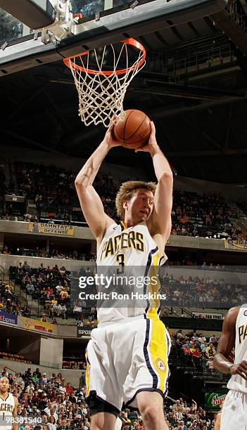 Troy Murphy of the Indiana Pacers rebounds against the New Jersey Nets at Conseco Fieldhouse on April 10, 2010 in Indianapolis, Indiana. NOTE TO...
