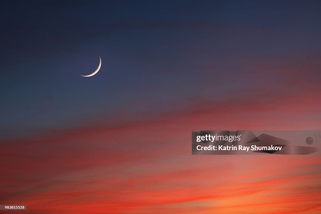 Crescent Moon in Glowing Sunset Skies