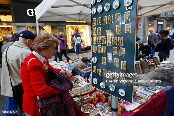 Woman looks at images of the Holy Shroud on April 10, 2010 in Turin, Italy. The Holy Shroud will be displayed at the Cathedral of Torino from April...