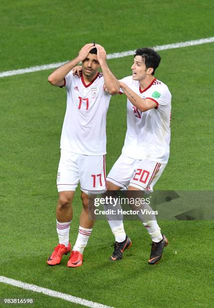 Mehdi Taremi of Iran is consoled by teammate Sardar Azmoun after missing a chance during the 2018 FIFA World Cup Russia group B match between Iran...