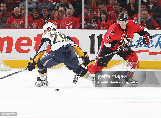 Jason Spezza of the Ottawa Senators stickhandles the puck around Jason Pominville of the Buffalo Sabres at Scotiabank Place on April 10, 2010 in...