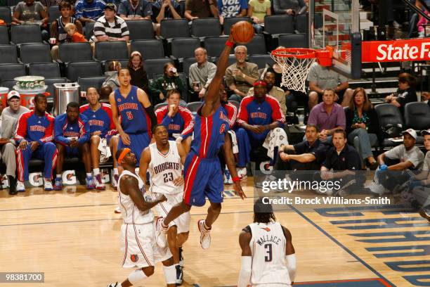 Ben Wallace of the Detroit Pistons dunks against Gerald Wallace of the Charlotte Bobcats on April 10, 2010 at the Time Warner Cable Arena in...