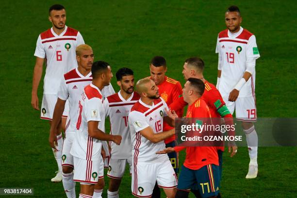 Morocco's forward Noureddine Amrabat argues with Spain's forward Iago Aspas during the Russia 2018 World Cup Group B football match between Spain and...