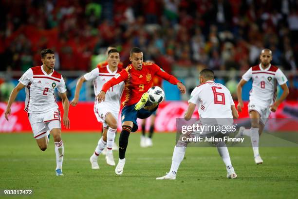 Rodrigo of Spain and Romain Saiss of Morocco battles for possession during the 2018 FIFA World Cup Russia group B match between Spain and Morocco at...