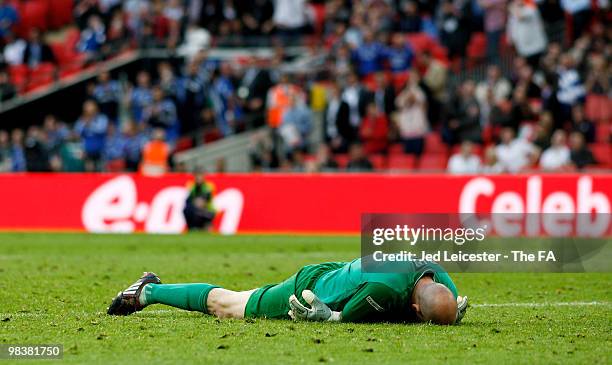 Goalkeeper Brad Friedel of Aston Villa lies on the ground dejected after a goal during the FA Cup sponsored by E.ON Semi Final match between Aston...