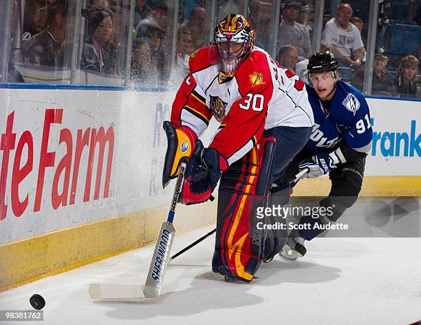 Goaltender Scott Clemmensen of the Florida Panthers clears the puck past Steven Stamkos of the Tampa Bay Lightning at the St. Pete Times Forum on...
