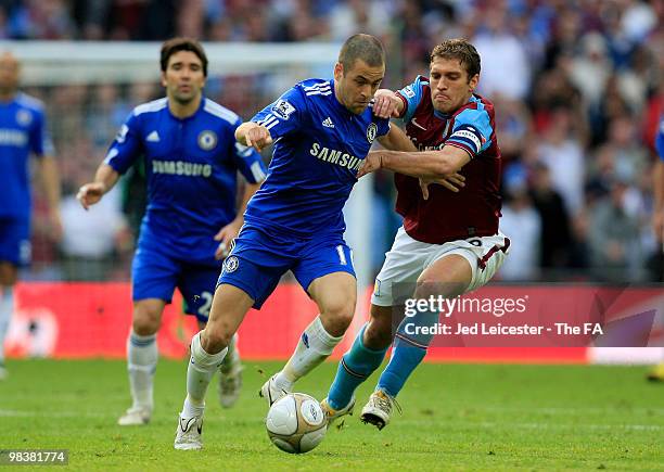 Joe Cole of Chelsea is held by Stiliyan Petrov of Aston Villa during the FA Cup sponsored by E.ON Semi Final match between Aston Villa and Chelsea at...