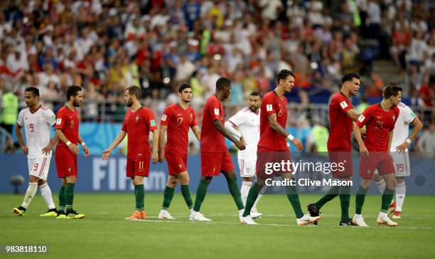 Portugal players react after Cedric receives a yellow card from Referee Enrique Caceres the 2018 FIFA World Cup Russia group B match between Iran and...