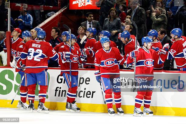 Members of the Montreal Canadiens celebrate the first period goal by Andrei Markov during the NHL game against the Toronto Maple Leafs on April 10,...