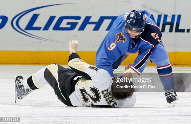 Matt Cooke of the Pittsburgh Penguins is knocked out by this right-handed punch from Evander Kane of the Atlanta Thrashers at Philips Arena on April...
