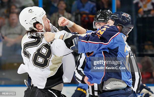 Eric Godard of the Pittsburgh Penguins fights with Eric Boulton of the Atlanta Thrashers at Philips Arena on April 10, 2010 in Atlanta, Georgia.