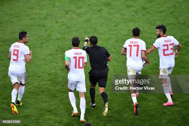 Referee Enrique Caceres gestures to award Iran with a penalty during the 2018 FIFA World Cup Russia group B match between Iran and Portugal at...