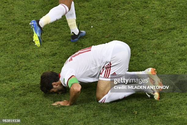 Iran's forward Karim Ansari Fard celebrates scoring a penalty with his teammates during the Russia 2018 World Cup Group B football match between Iran...