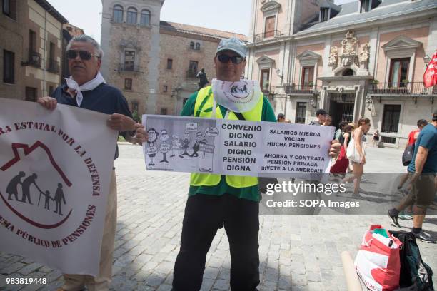 Protester seen holding a banner during the demonstration. Madrid pensioners take the street in a protest to demand the state pension to be increased...