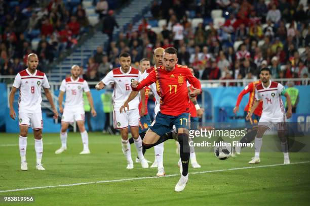 Iago Aspas of Spain back heels in past Monir El Kajoui of Morocco to score his sides second goal during the 2018 FIFA World Cup Russia group B match...