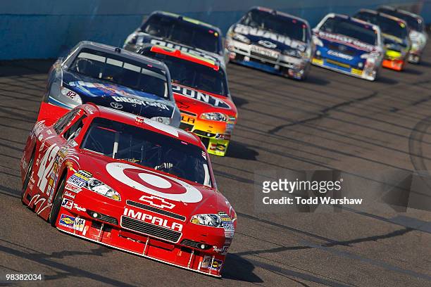 Juan Pablo Montoya, driver of the Target Chevrolet, leads the field during the NASCAR Sprint Cup Series SUBWAY Fresh Fit 600 at Phoenix International...