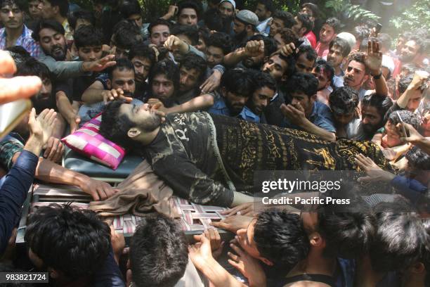 People carrying the dead body of Shakoor Ahmed Dar. Thousands of people on Monday took part in the last rites of Lashkar-e-Toiba Commander Shakoor...