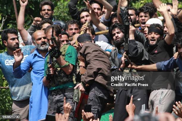 Militants offer gun salute to there laid comrade. Thousands of people on Monday took part in the last rites of Lashkar-e-Toiba Commander Shakoor...