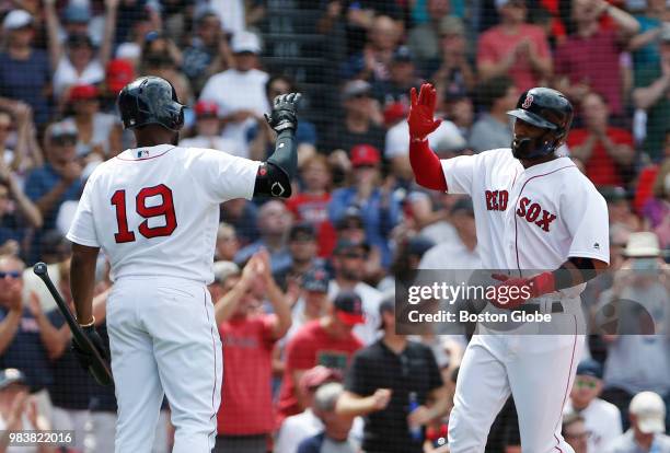 Boston Red Sox player Eduardo Nunez, right, celebrates his run with teammate Jackie Bradley Jr. During the fifth inning. The Boston Red Sox host the...