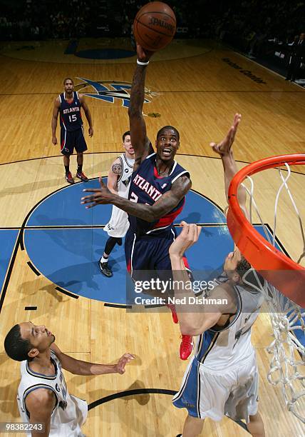 Marvin Williams of the Atlanta Hawks shoots against JaVale McGee of the Washington Wizards at the Verizon Center on April 10, 2010 in Washington, DC....