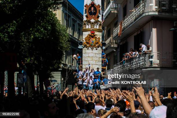 People called "portatori" carry the "Gigli" an 25 metre high wooden obelisk weighing 3 tonnes carry by 160 persone along the streets of the small...