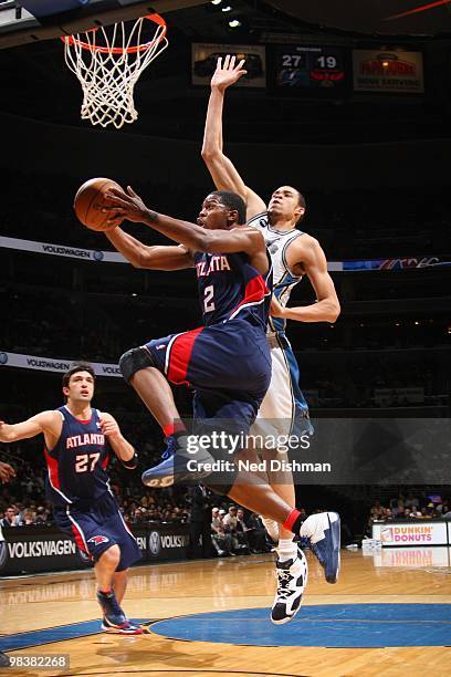 Joe Johnson of the Atlanta Hawks shoots against JaVale McGee of the Washington Wizards at the Verizon Center on April 10, 2010 in Washington, DC....