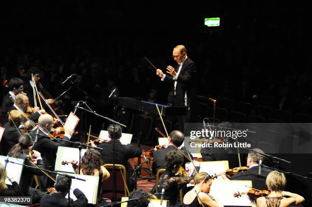 Ennio Morricone conducts his orchestra on stage at Royal Albert Hall on April 10, 2010 in London, England.