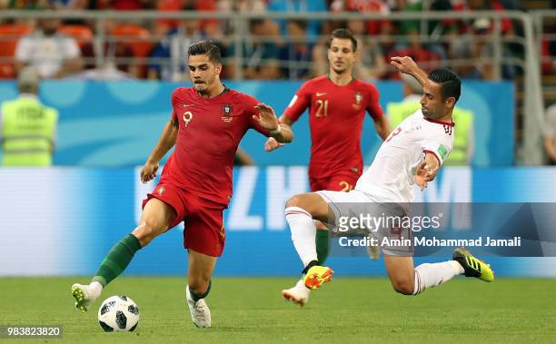 Andre Silva of Portugal and Omid Ebrahimi in action during the 2018 FIFA World Cup Russia group B match between Iran and Portugal at Mordovia Arena...