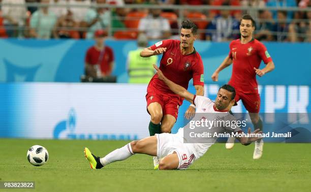 Andre Silva of Portugal and Omid Ebrahimi in action during the 2018 FIFA World Cup Russia group B match between Iran and Portugal at Mordovia Arena...