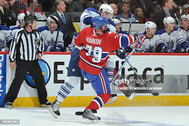 Andrei Markov of Montreal Canadiens collides with Tyler Bozak of the Toronto Maple Leafs during the NHL game on April 10, 2010 at the Bell Center in...