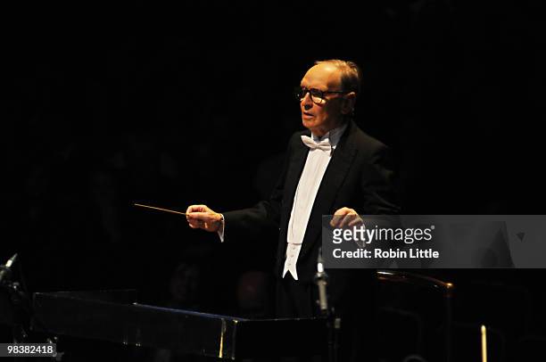Ennio Morricone conducts his orchestra on stage at Royal Albert Hall on April 10, 2010 in London, England.