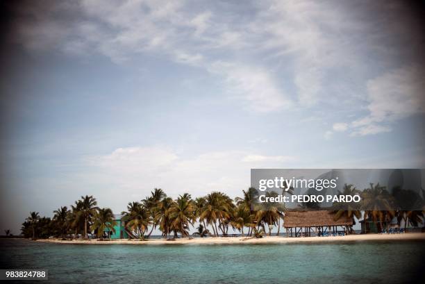 View of the Laughing Bird Caye National Park in the outskirts of Placencia village, in Stann Creek District, Belize, on June 6, 2018. - Backed by...