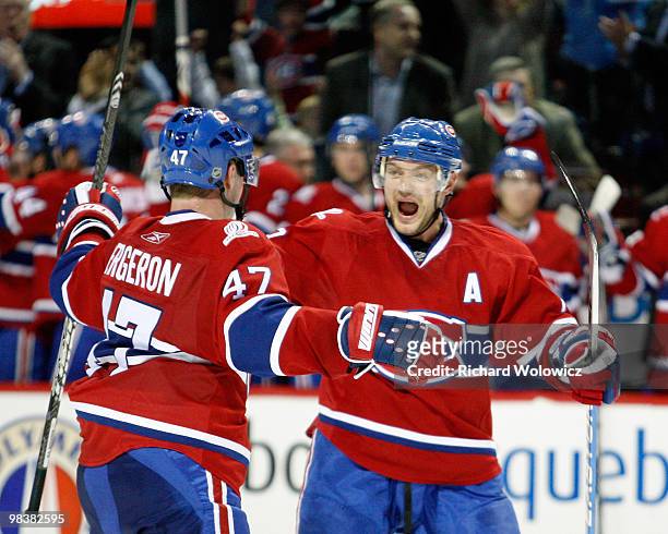 Andrei Markov celebrates the second period goal by Marc-Andre Bergeron of the Montreal Canadiens during the NHL game against the Toronto Maple Leafs...