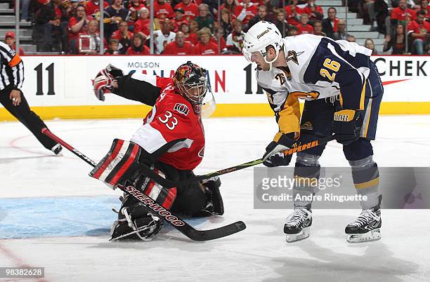 Thomas Vanek of the Buffalo Sabres scores a goal on a penalty shot against Pascal Leclaire of the Ottawa Senators at Scotiabank Place on April 10,...