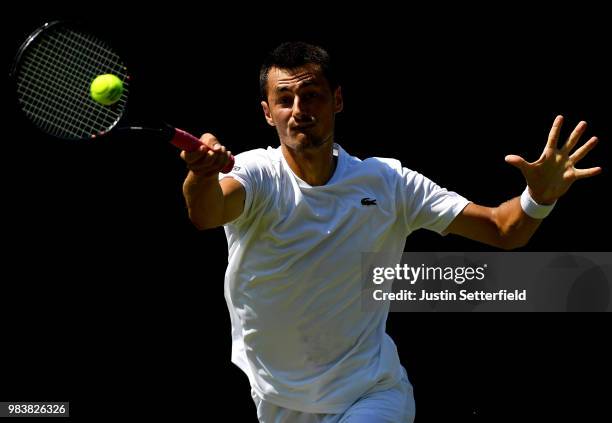 Bernard Tomic of Australia in action against Matteo Donati of Italy during the Wimbledon Lawn Tennis Championships Qualifying at The Bank of England...