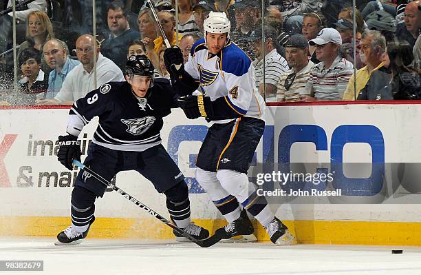 Marcel Goc of the Nashville Predators skates against Eric Brewer of the St. Louis Blues on April 10, 2010 at the Bridgestone Arena in Nashville,...