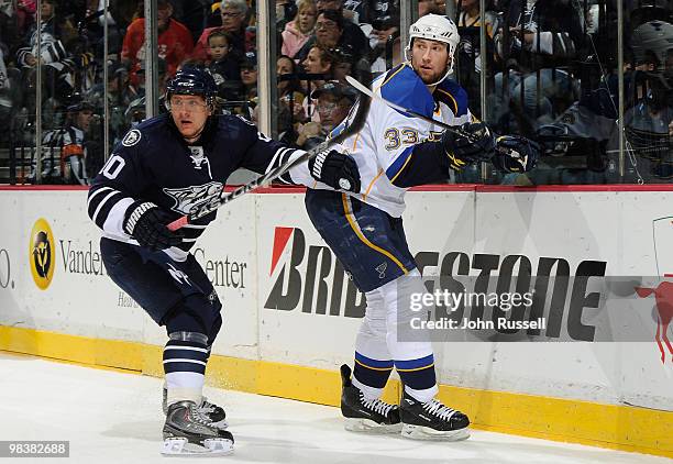 Martin Erat of the Nashville Predators skates against Tyson Strachan of the St. Louis Blues on April 10, 2010 at the Bridgestone Arena in Nashville,...