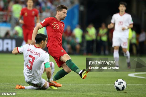Adrien Silva of Portugal, Ehsan Hajsafi of Iran during the 2018 FIFA World Cup Russia group B match between Iran and Portugal at Mordovia Arena on...