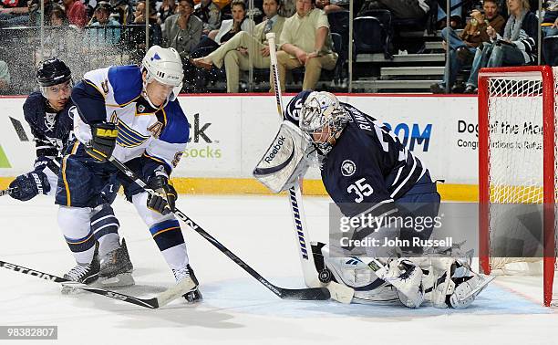 Pekka Rinne of the Nashville Predators makes a save against Paul Kariya of the St. Louis Blues on April 10, 2010 at the Bridgestone Arena in...