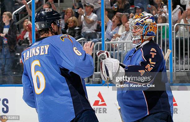 Goaltender Johan Hedberg of the Atlanta Thrashers celebrates their 1-0 win over the Pittsburgh Penguins with Ron Hainsey at Philips Arena on April...