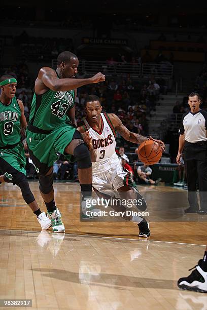 Brandon Jennings of the Milwaukee Bucks drives to the basket against Kendrick Perkins of the Boston Celtics on April 10, 2010 at the Bradley Center...