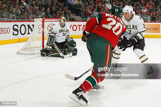 Goalie Kari Lehtonen of the Dallas Stars blocks the shot of Antti Miettinen of the Minnesota Wild during the game at the Xcel Energy Center on April...