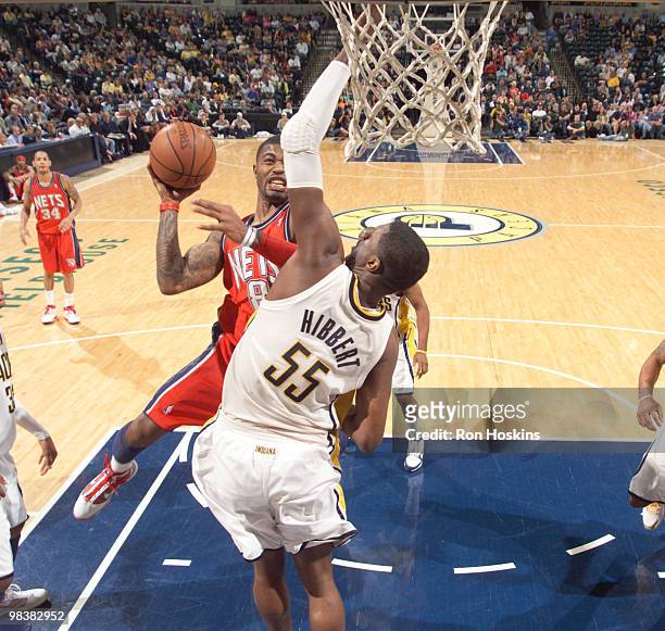 Terrence Williams of the New Jersey Nets shoots over Roy Hibbert of the Indiana Pacers at Conseco Fieldhouse on April 10, 2010 in Indianapolis,...
