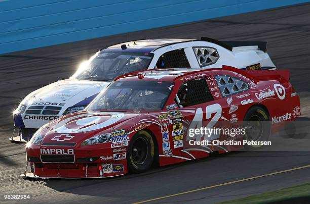 Juan Pablo Montoya, driver of the Target Chevrolet, drives alongside Terry Cook, driver of the Whitney Motorsports Dodge, during the NASCAR Sprint...