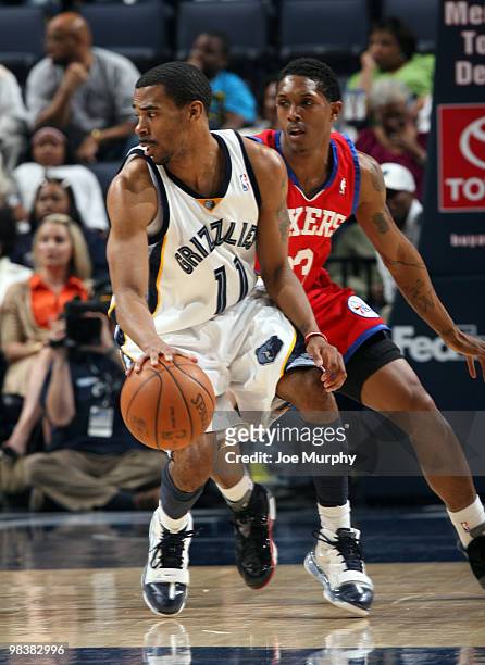 Mike Conley of the Memphis Grizzlies is guarded by Louis Williams of the Philadelphia 76ers on April 10, 2010 at FedExForum in Memphis, Tennessee....