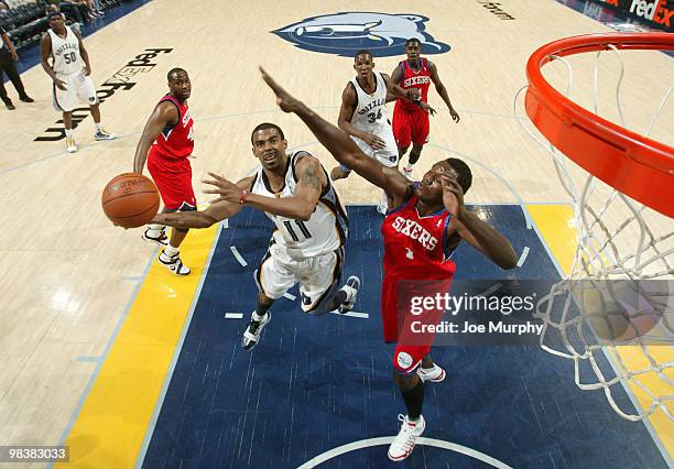 Mike Conley of the Memphis Grizzlies shoots against Samuel Dalembert of the Philadelphia 76ers on April 10, 2010 at FedExForum in Memphis, Tennessee....