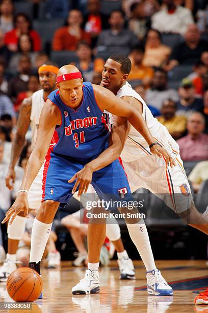 Derrick Brown of the Charlotte Bobcats goes for the steal against Charlie Villanueva of the Detroit Pistons on April 10, 2010 at the Time Warner...
